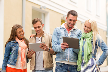 Image showing group of smiling friends with tablet pc computers