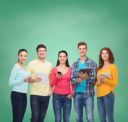 Image showing group of teenagers with smartphones and tablet pc