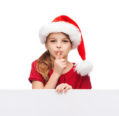 Image showing child in santa helper hat with blank white board