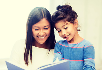 Image showing mother and daughter with book