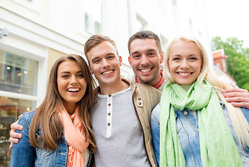 Image showing group of smiling friends in city