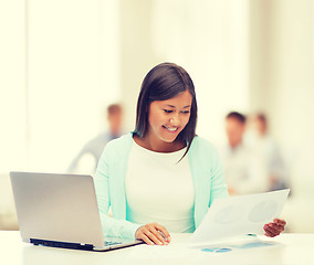 Image showing asian businesswoman with laptop and documents