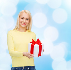 Image showing smiling girl with gift box