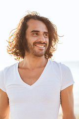 Image showing smiling man in white blank shirt outdoors