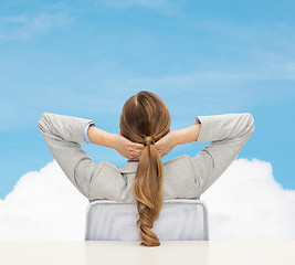 Image showing businesswoman sitting on chair from back