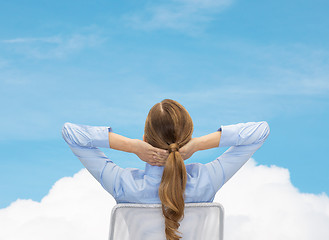 Image showing businesswoman sitting on chair from back