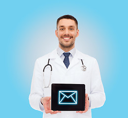 Image showing smiling male doctor with tablet pc