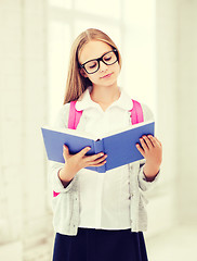 Image showing girl reading book at school