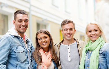 Image showing group of smiling friends in city