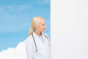 Image showing smiling female doctor with stethoscope