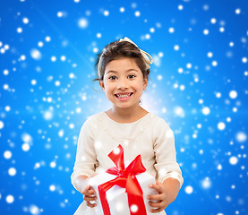 Image showing smiling little girl with gift box