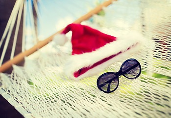 Image showing hammock with santa helper hat and shades