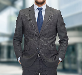 Image showing close up of businessman standing outdoors