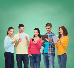 Image showing group of teenagers with smartphones and tablet pc