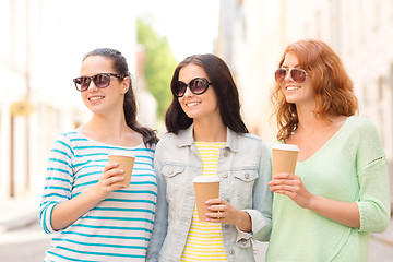 Image showing smiling teenage girls with on street