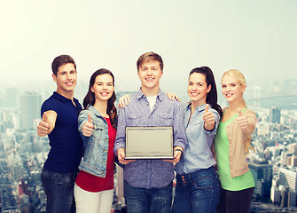 Image showing smiling students with laptop computer