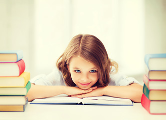 Image showing pretty girl with many books at school