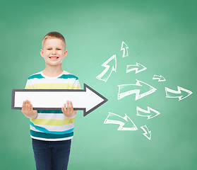 Image showing smiling little boy with blank arrow pointing right