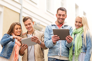 Image showing group of smiling friends with tablet pc computers