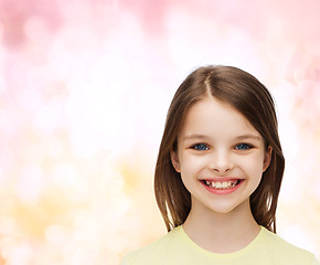 Image showing smiling little girl over white background