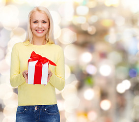 Image showing smiling girl with gift box