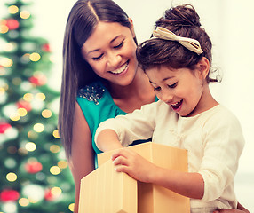 Image showing happy mother and child girl with gift box