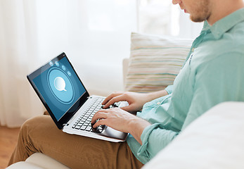 Image showing close up of man working with laptop at home