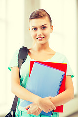 Image showing student girl with school bag and notebooks