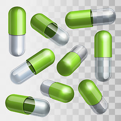 Image showing Set of green and transparent medical capsules in different positions