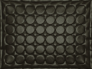 Image showing Bumped black leather background with circles