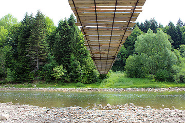 Image showing nice hanging bridge across river