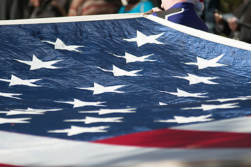 Image showing american flag carried at the parade