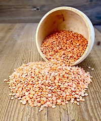 Image showing Lentils red in wooden bowl on the board