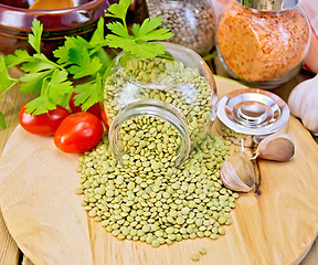 Image showing Lentils green in jar with parsley on board