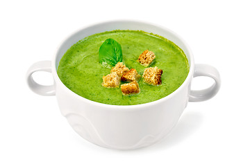Image showing Soup puree with croutons and spinach in bowl