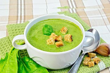 Image showing Soup puree with spinach and garlic on fabric