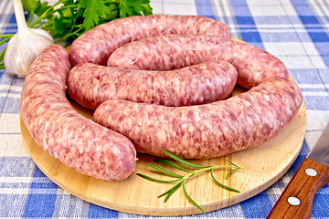 Image showing Sausages pork on blue cloth