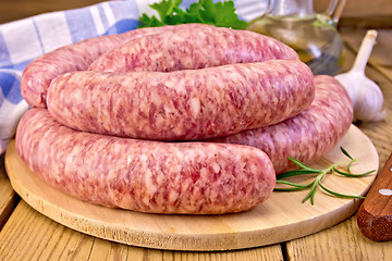 Image showing Sausages pork on board with oil