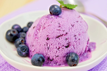 Image showing Ice cream blueberry with mint on plate