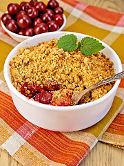 Image showing Crumble cherry on napkin and a board