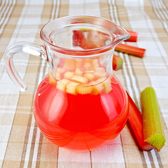 Image showing Compote from rhubarb in a jug on tablecloth