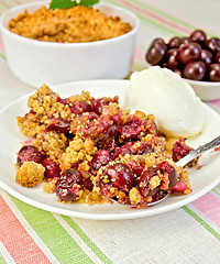 Image showing Crumble cherry with berries on plate