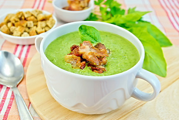 Image showing Soup puree with bacon and croutons on fabric