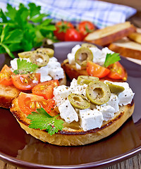 Image showing Sandwich with feta and olives on board