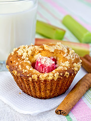 Image showing Cupcake with rhubarb and milk on napkin