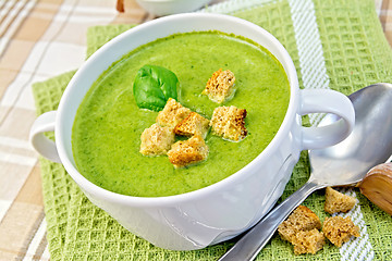 Image showing Soup puree with croutons and spinach leaves on napkin