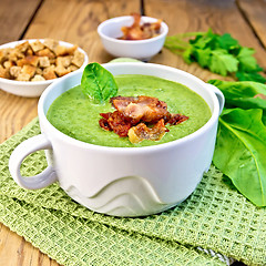 Image showing Soup puree with bacon and croutons on board