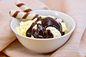 Image showing Ice cream vanilla with waffles on napkin