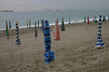 Image showing Parasols on empty beach