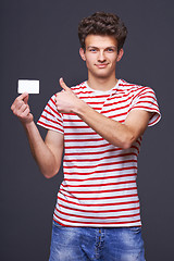 Image showing Man showing empty blank paper card sign